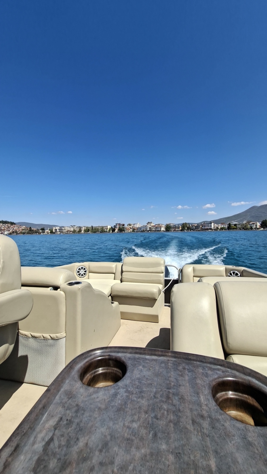 Sunset cruise on Lake Ohrid with mountain backdrop